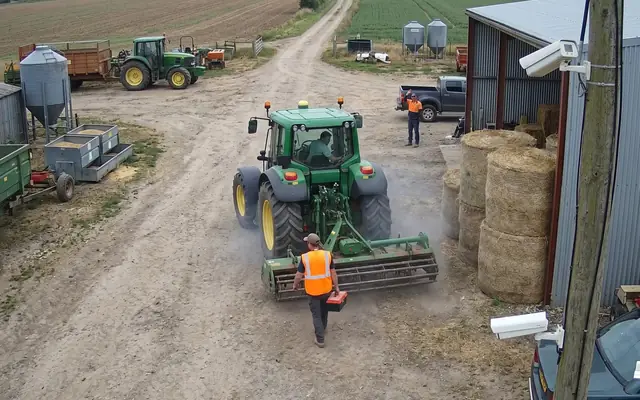 A forklift operating close to a pedestrian worker inside a warehouse