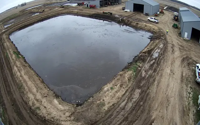 An open excavation trench with no barrier or fence around it