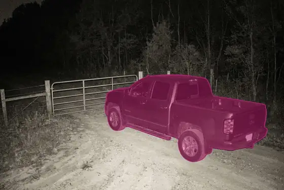 AI segmentation flagging a pickup truck loitering at a farm gate at night
