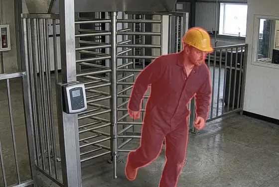 AI segmentation flagging a worker slipping past a gate without scanning their access pass