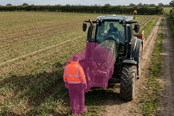 AI segmentation flagging a tractor reversing too close to a worker in a field