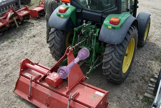 AI segmentation flagging an exposed rotating PTO shaft on a tractor implement