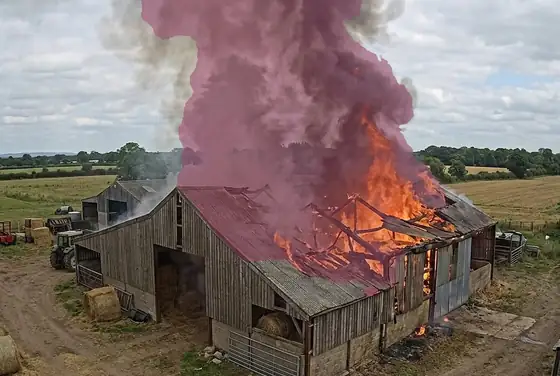 AI segmentation outlining flames and smoke rising from a hay barn