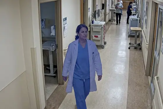 AI segmentation mask on a clinician entering a ward without a surgical mask