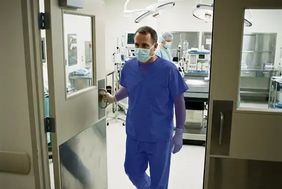 AI segmentation mask on a clinician entering an OR without a surgical cap