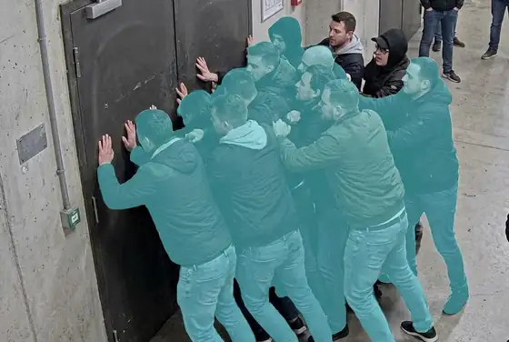 AI segmentation mask on people pushing at a closed door, surge pressure detection