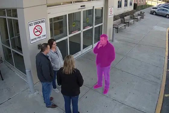 AI segmentation mask on visitors gathering outside the ED entrance, smoke-free zone breach