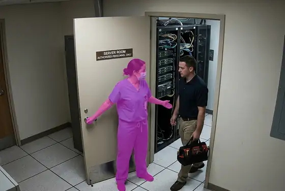 AI segmentation mask on a person holding a door open for another at a hospital server room