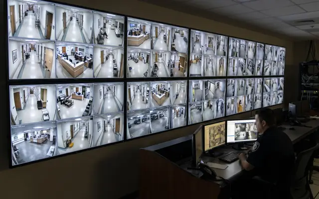An existing CCTV camera on a building with a small edge-AI box beside it