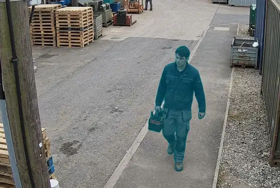 AI segmentation mask on a yard worker walking with no hard hat
