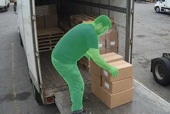 AI segmentation mask on a worker loading a trailer with no safety boots