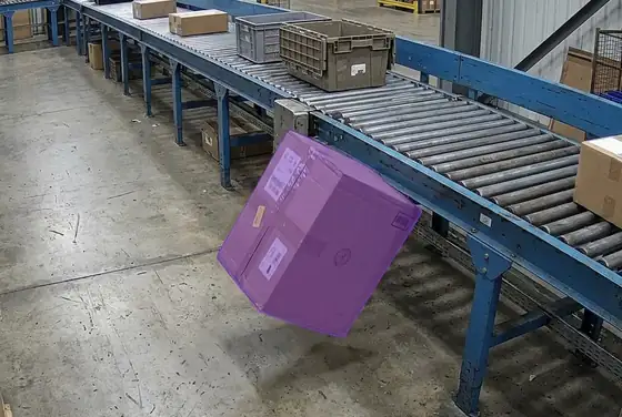 AI segmentation mask on a parcel falling from a conveyor onto the floor