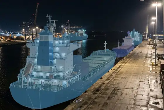AI segmentation marking berth occupancy across a quay wall at night