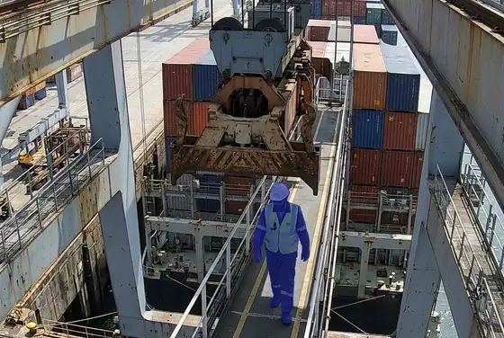 AI segmentation flagging a worker walking beneath a suspended ship-to-shore crane spreader
