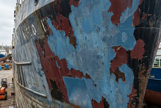 AI segmentation outlining paint loss and coating breakdown on a ship hull