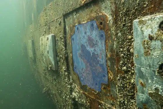 AI segmentation flagging a missing sacrificial zinc anode on a vessel hull