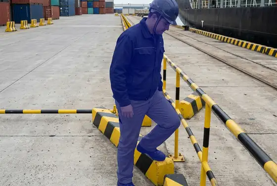 AI segmentation flagging a person crossing into a restricted quay zone marked by barriers