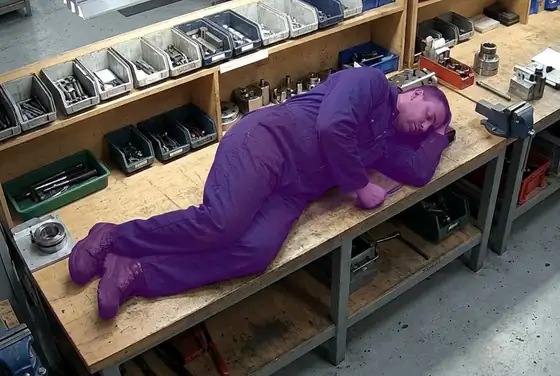 AI segmentation flagging a worker lying motionless on the bench (man-down)