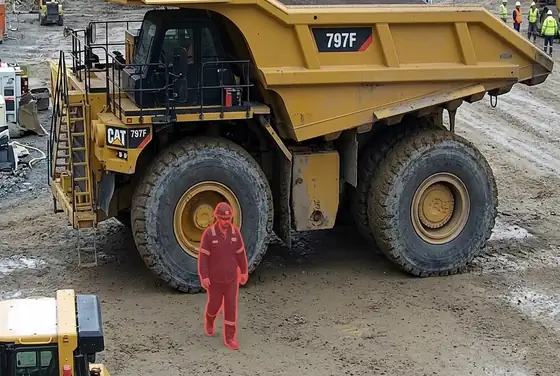 AI segmentation flagging a worker without a hi-vis vest near a haul truck