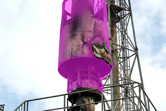 AI segmentation mask highlighting a flare tip with visible damage