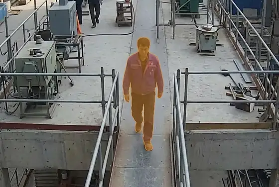 AI segmentation mask flagging a worker without a hard hat on a platform