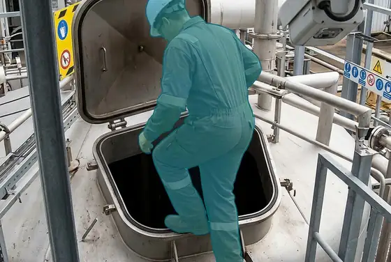 AI segmentation mask highlighting a worker entering a confined space without a permit