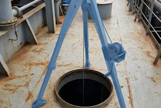 AI segmentation mask on a tripod and winch set up over a vessel manhole
