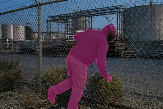 AI segmentation mask on a person breaching the perimeter fence of a remote plant plot