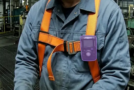 AI segmentation mask on a personal H2S monitor clipped to a worker's chest harness