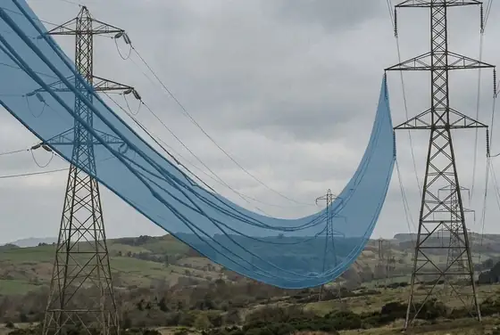 AI segmentation mask on a sagging conductor span between two towers