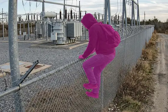 AI segmentation mask on a person breaching a substation perimeter fence