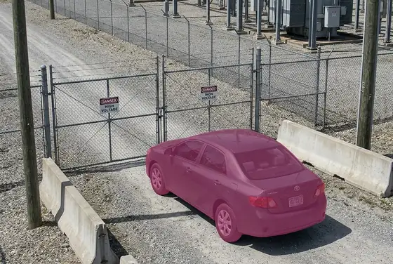AI segmentation mask on an unauthorized vehicle stopped at a substation gate