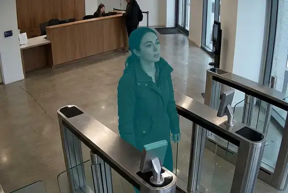AI segmentation mask on a resident's face being granted access at a tower lobby turnstile