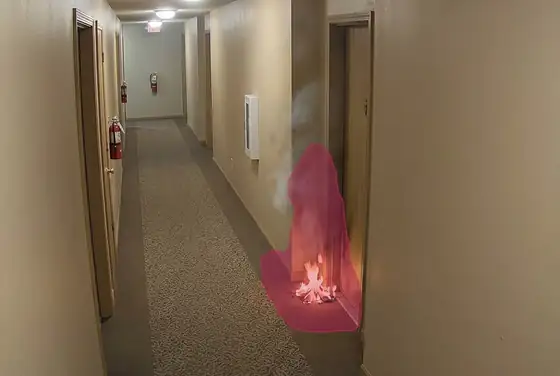 AI segmentation mask on early flame in a residential corridor