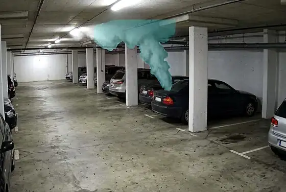 AI segmentation mask on smoke plume rising in a basement car park