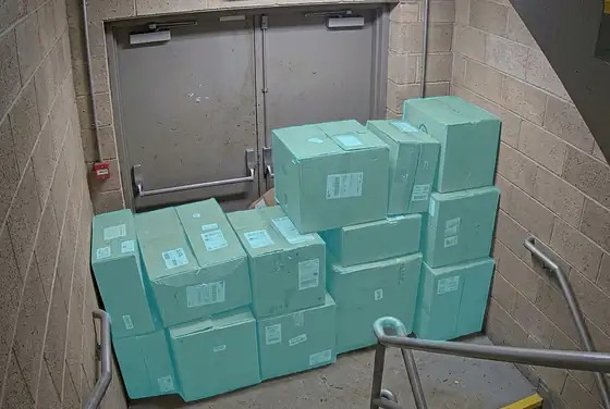 AI segmentation mask on boxes blocking a fire-exit stairwell door