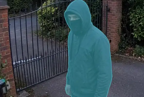 AI segmentation mask on an unknown face blocked at a residential gate