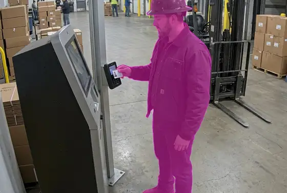 AI segmentation mask on a contractor badge being validated at a loading bay