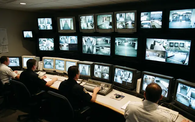 An existing CCTV camera on a building with a small edge-AI box beside it