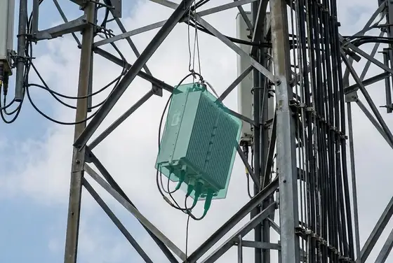 AI segmentation mask on a dislodged RRU/TMA unit hanging on a tower