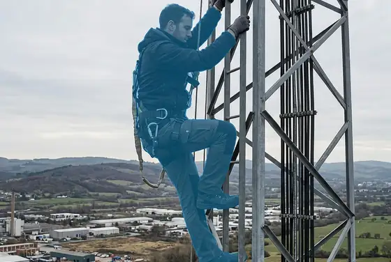 AI segmentation mask on a climber with no hard hat on a tower