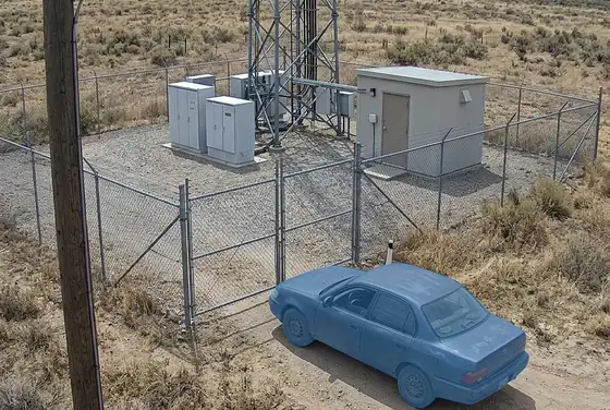 AI segmentation mask on an unauthorized vehicle stopped outside a remote BTS compound