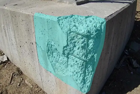 AI segmentation mask on spalled concrete at a tower foundation pad