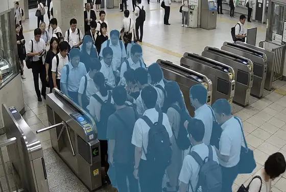 AI segmentation masks highlighting a pedestrian bottleneck at a station gate