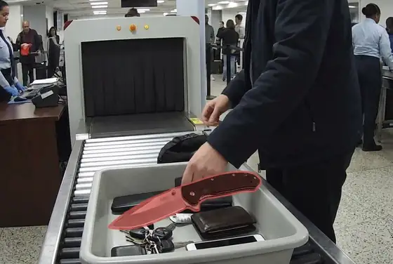AI segmentation mask outlining a knife blade at a security checkpoint