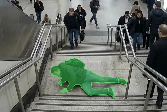 AI segmentation mask highlighting a passenger tumbled on a station staircase