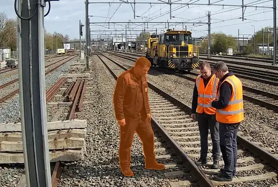 AI segmentation mask flagging a rail worker without a hi-vis vest on the track
