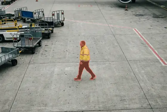 AI segmentation mask highlighting a worker on the apron without safety boots