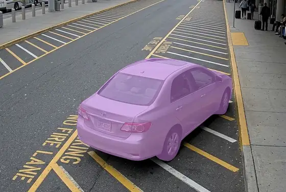 AI segmentation mask outlining a car parked in a no-parking fire lane at a terminal