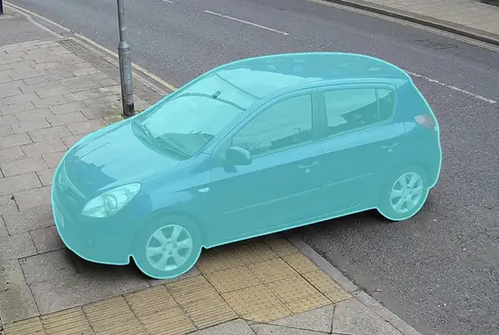 AI segmentation mask flagging a car parked over a dropped kerb at an accessibility ramp